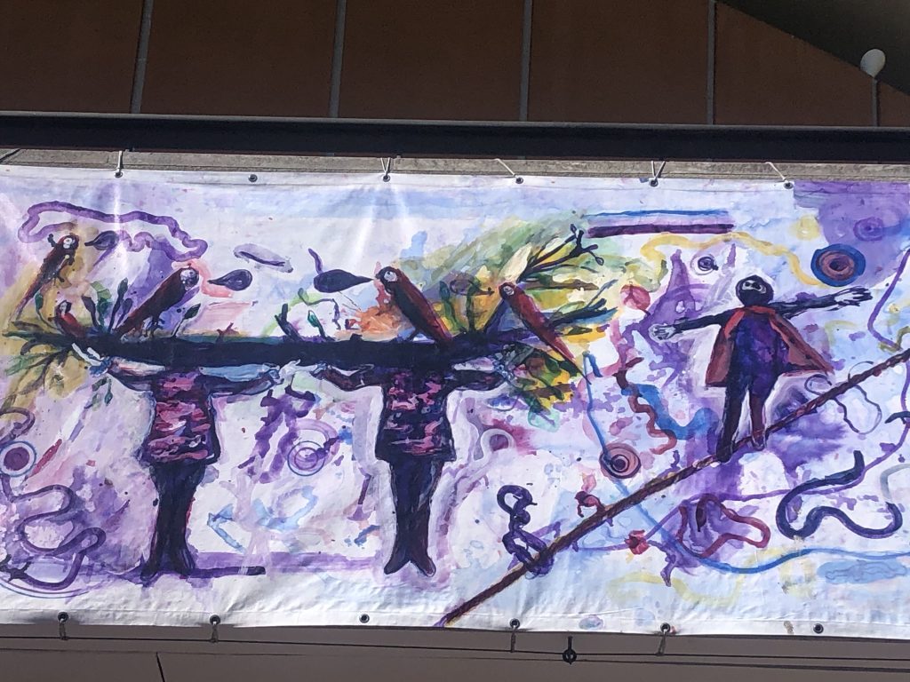Detail, Yassine Balbzioui, Golden Tree for Fake Hope (2026), paint on canvas, 60 m. Courtesy of the artist. Exterior View Tirailleurs, Haus der Kulturen der Welt (HKW), 2026@KatiaH.